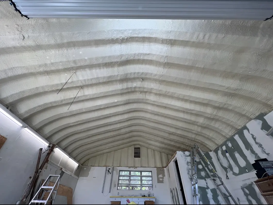 Spray polyurethane foam applied to the underside of a metal roof deck in Loomis